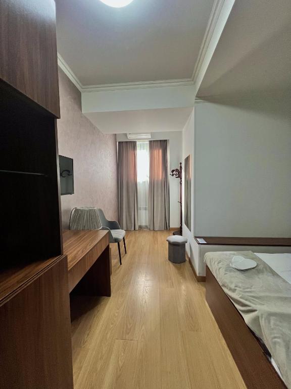 Postel nebo postele na pokoji v ubytování Mashtots Hotel