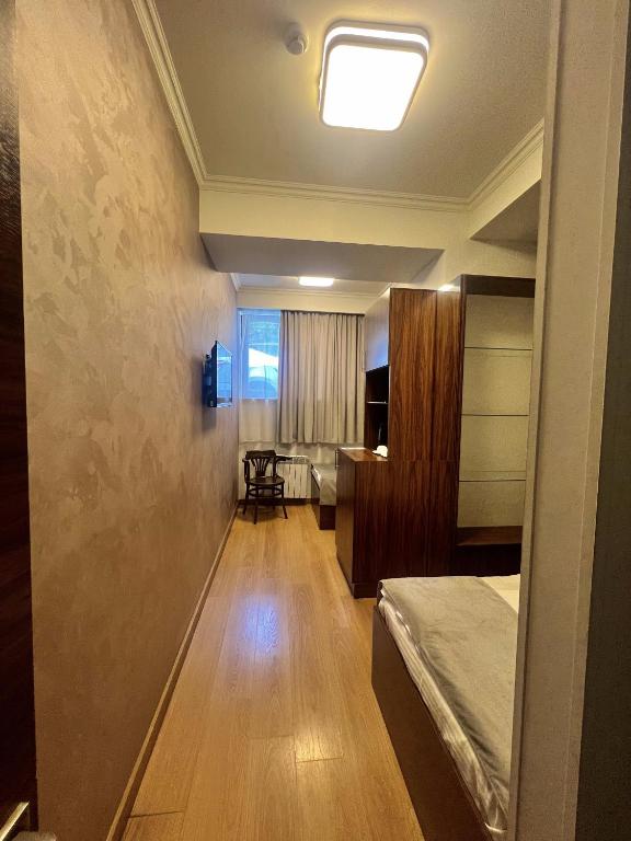 Postel nebo postele na pokoji v ubytování Mashtots Hotel