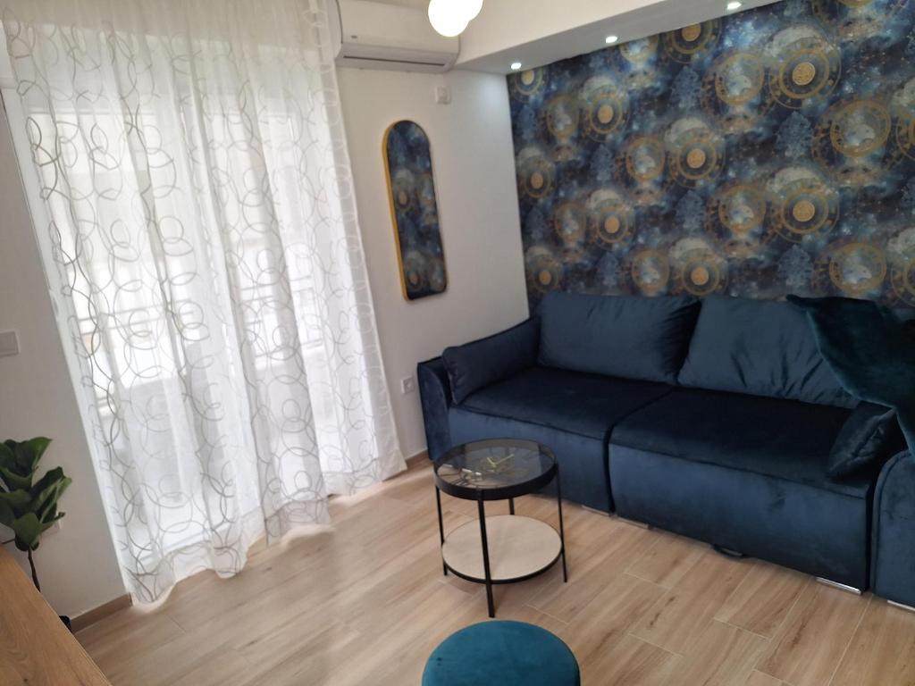 a living room with a couch and a table at Apartment Novi-Solaris in Herceg-Novi