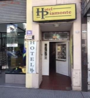 a store front with a sign for a store at Hotel Piamonte in Buenos Aires
