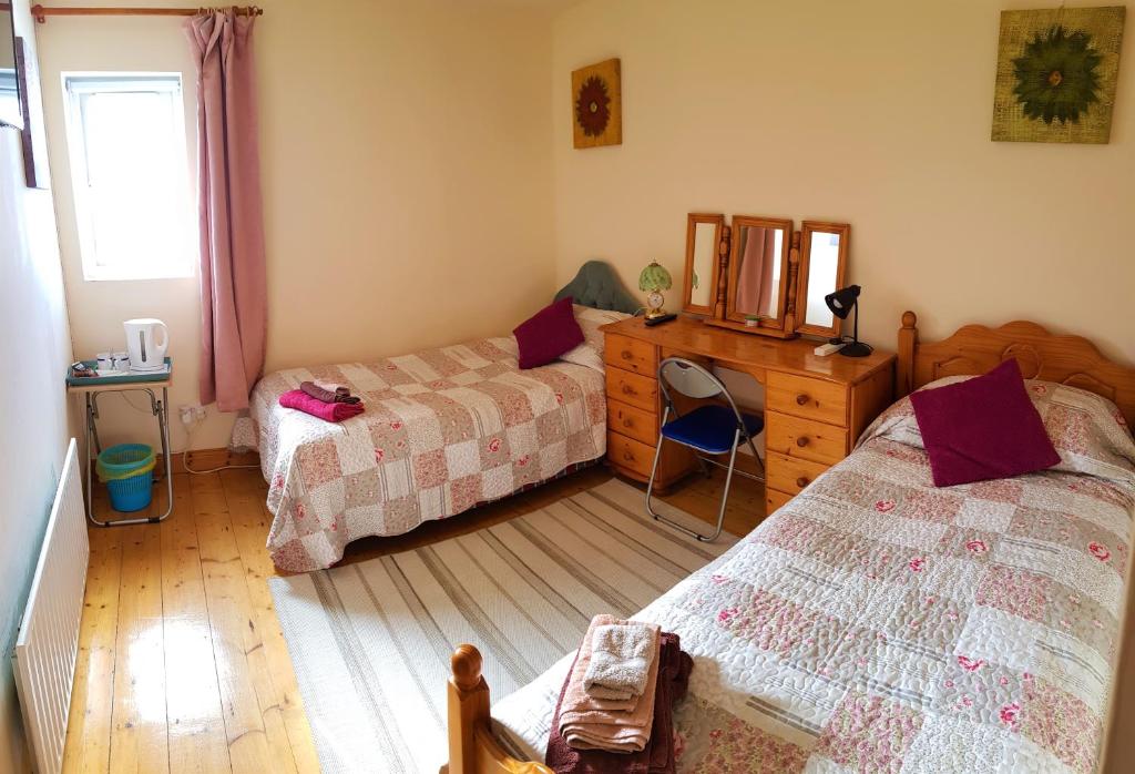 Postel nebo postele na pokoji v ubytování Bernie's Place - Homestay