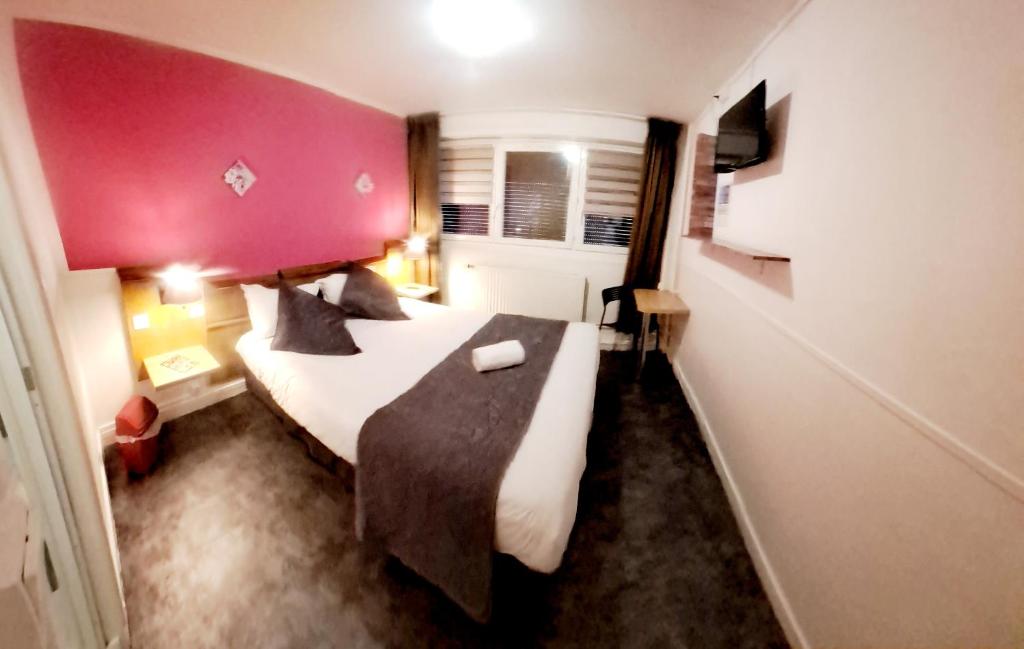Postel nebo postele na pokoji v ubytování Hôtel OpalOriental