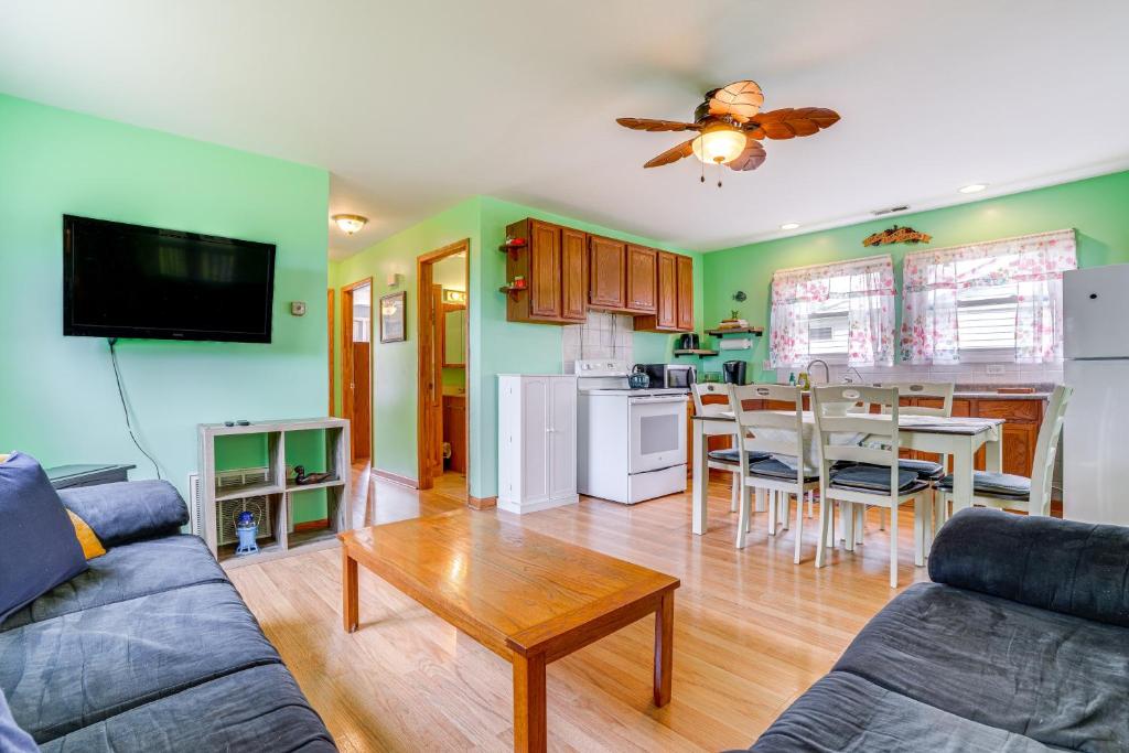 a living room with a couch and a table at Kayak, Fish, Boat and Swim Home Near Lakeside Park! in Woodland Beach