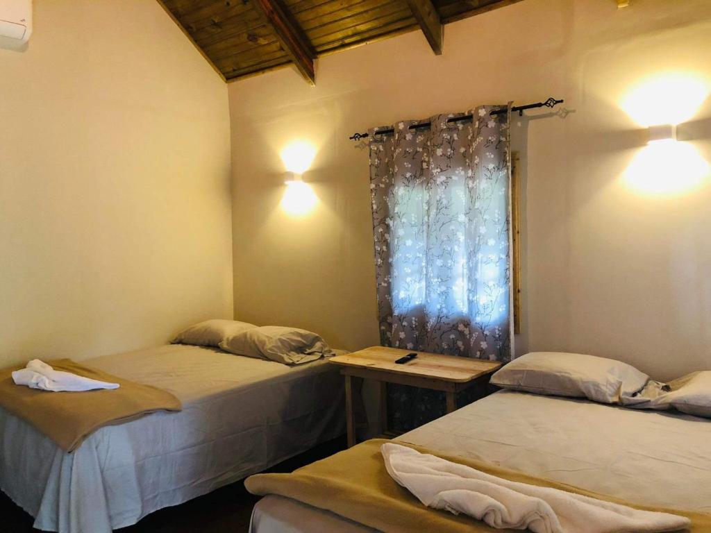 Postel nebo postele na pokoji v ubytování Cabaña de campo en el lago de yojoa