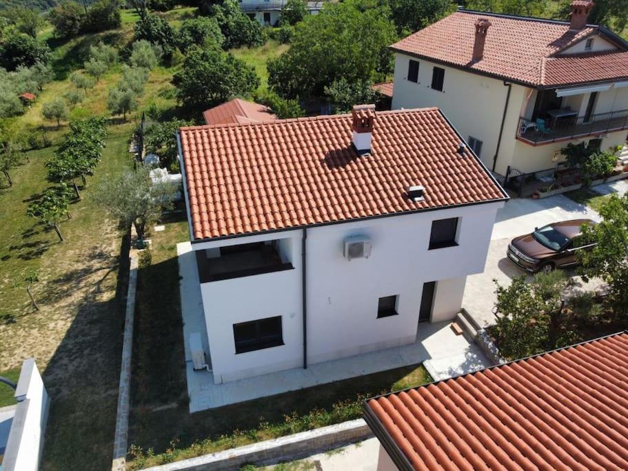an overhead view of a white house with a red roof at Hiša Naj in Koper
