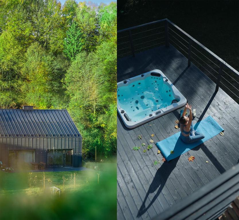 a woman sitting on a table next to a swimming pool at Rezydencja Bieszczady - Solina in Solina