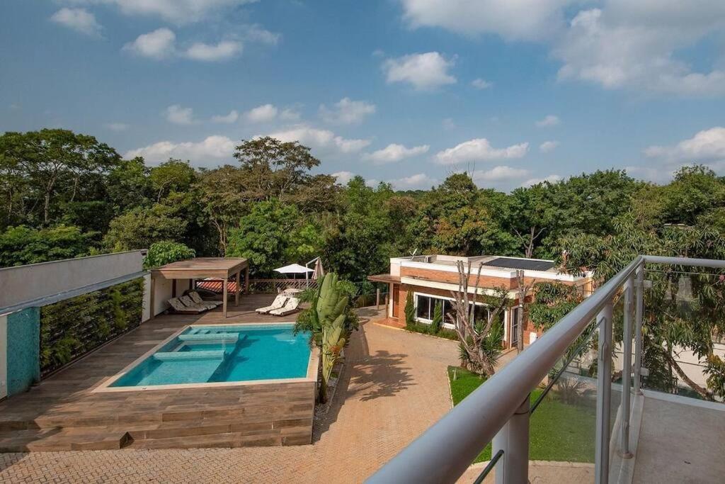 a house with a swimming pool on a balcony at Espaco Bom Viver in Jundiaí
