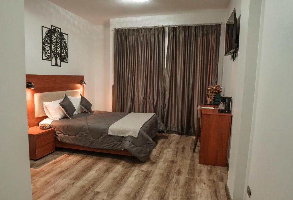 Postel nebo postele na pokoji v ubytování Hotel Sacha Golden