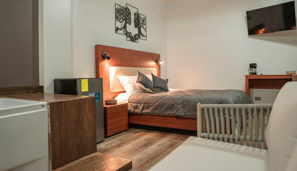 Postel nebo postele na pokoji v ubytování Hotel Sacha Golden