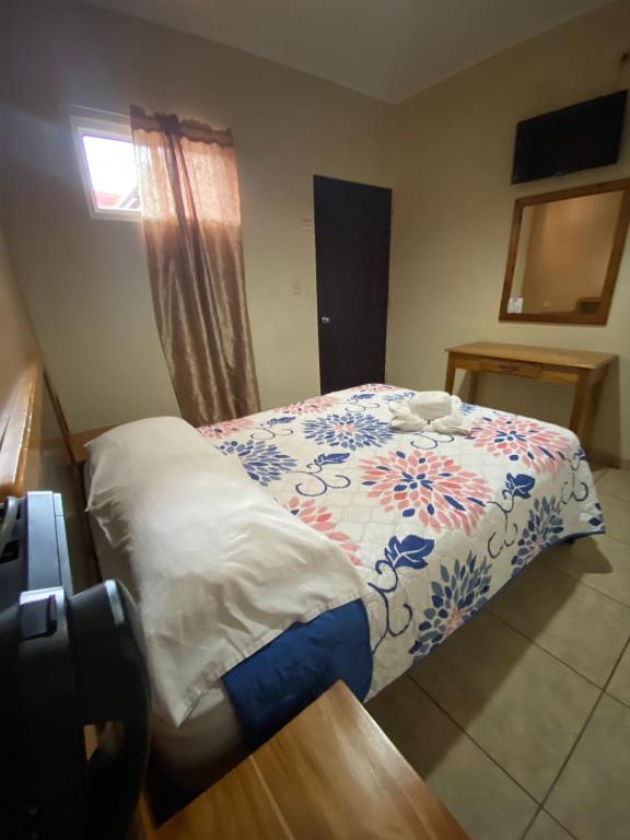Postel nebo postele na pokoji v ubytování Hotel Residencial Panamericano