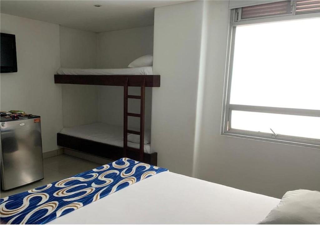 Postel nebo postele na pokoji v ubytování Hotel Romanza