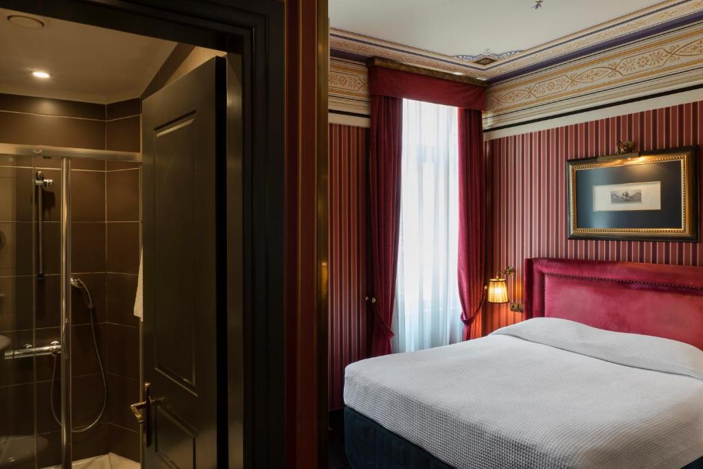 Posteľ alebo postele v izbe v ubytovaní Maison Grecque Hotel Extraordinaire
