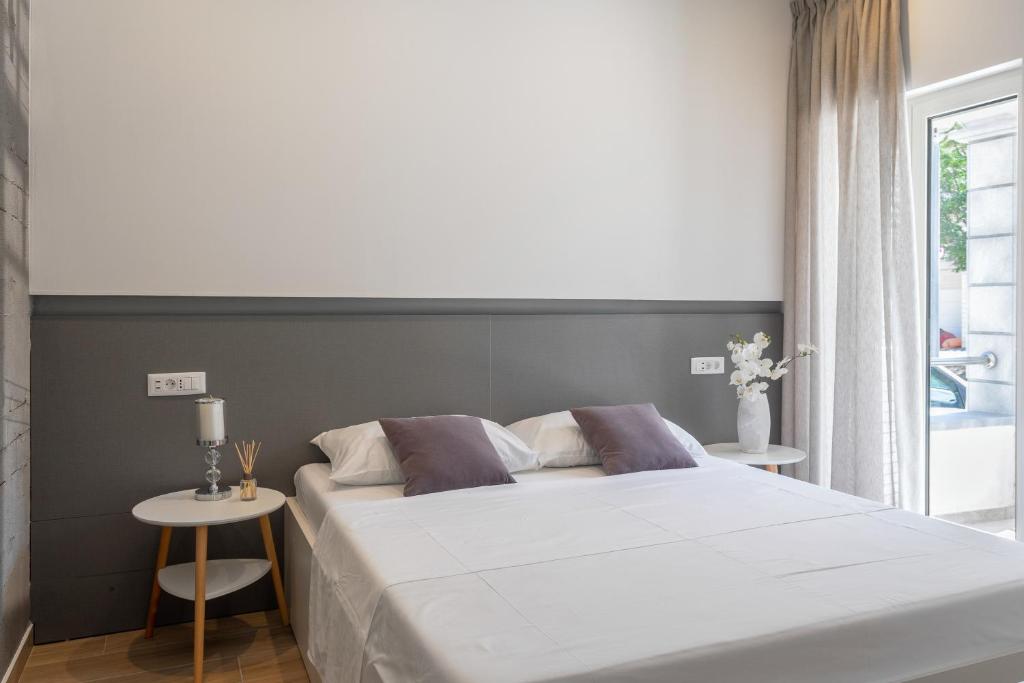 Postel nebo postele na pokoji v ubytování Apartmani Jakić 2