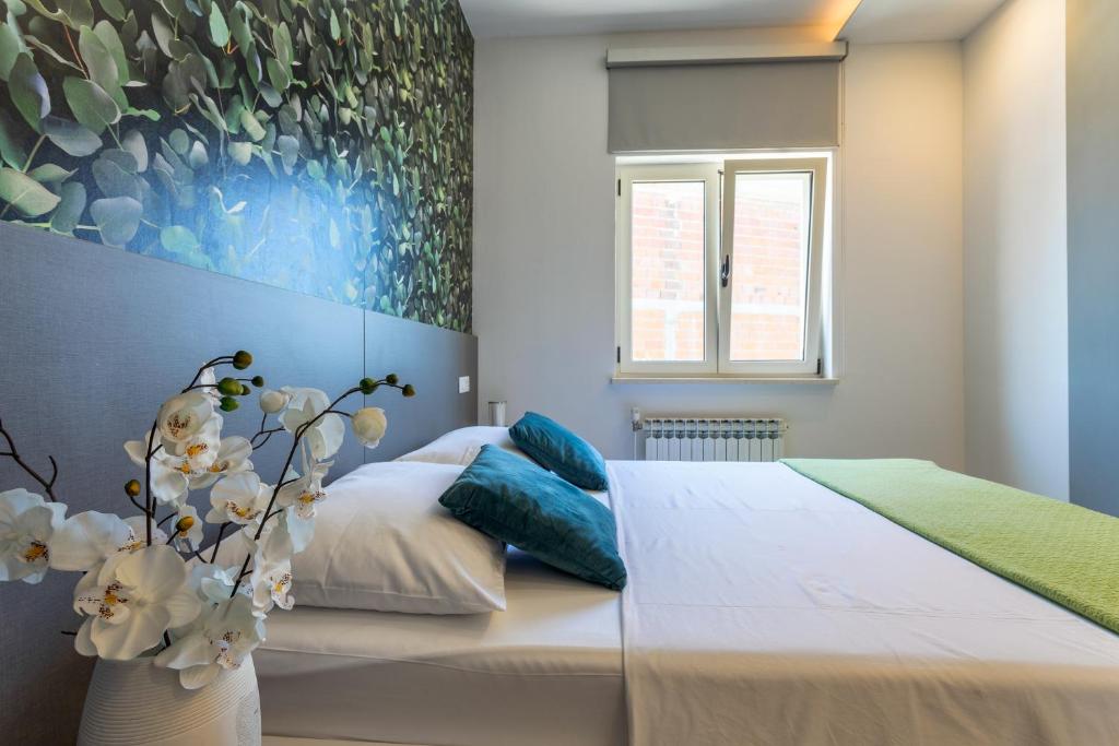 Postel nebo postele na pokoji v ubytování Apartmani Jakić 2