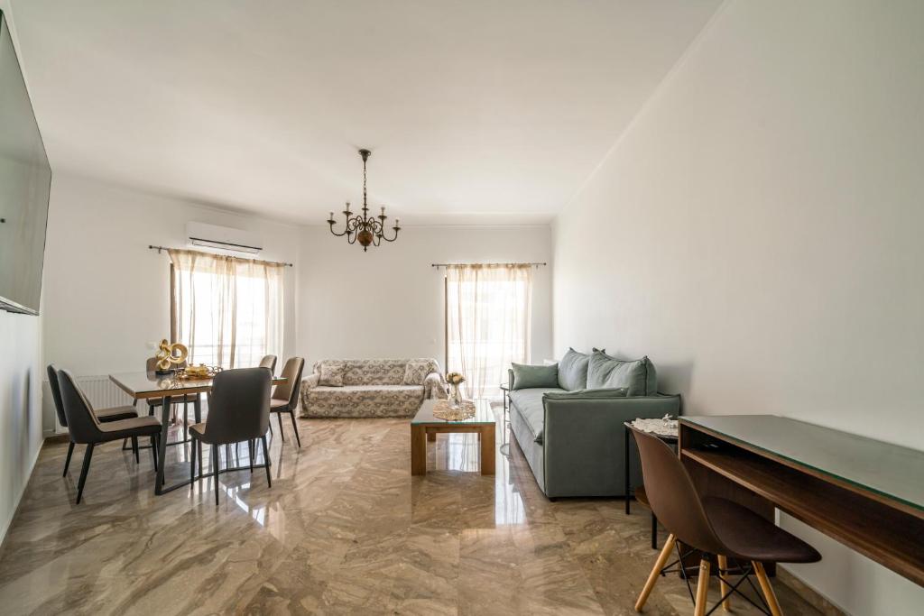 a living room with a couch and a table at NEON 2BR Luxurious Central Apt Heraklion in Heraklio Town