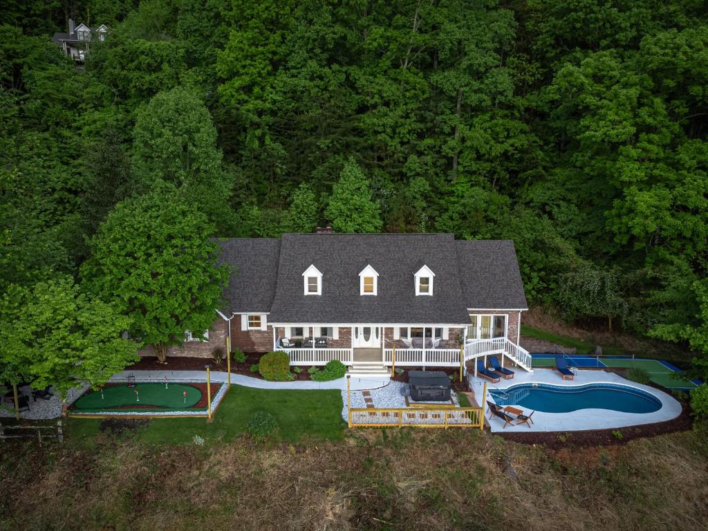 an aerial view of a large house with a swimming pool at Massive Asheville Compound A Memorable Experience in Weaverville