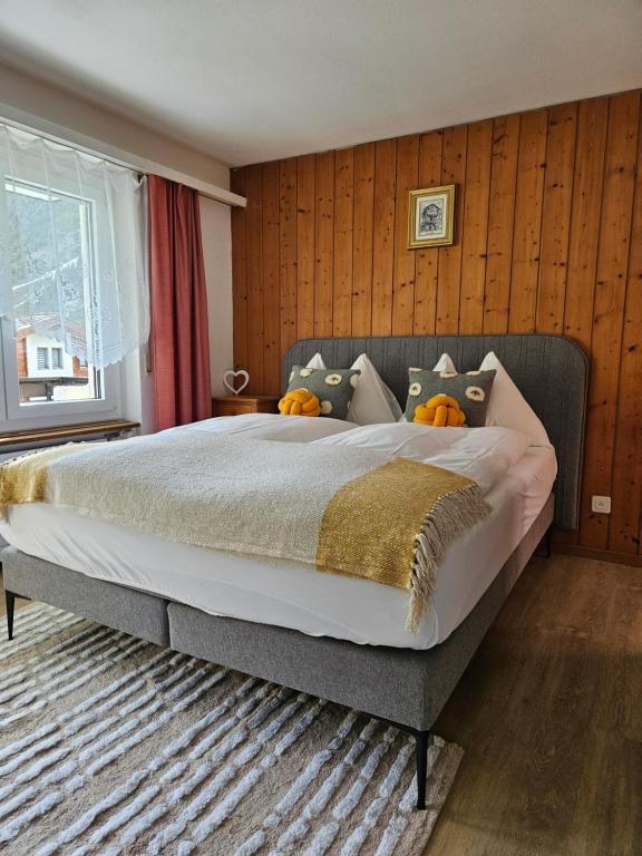 a bedroom with a large bed with pumpkins on it at Apartment Klein Matterhorn - Haus Miranda in Täsch