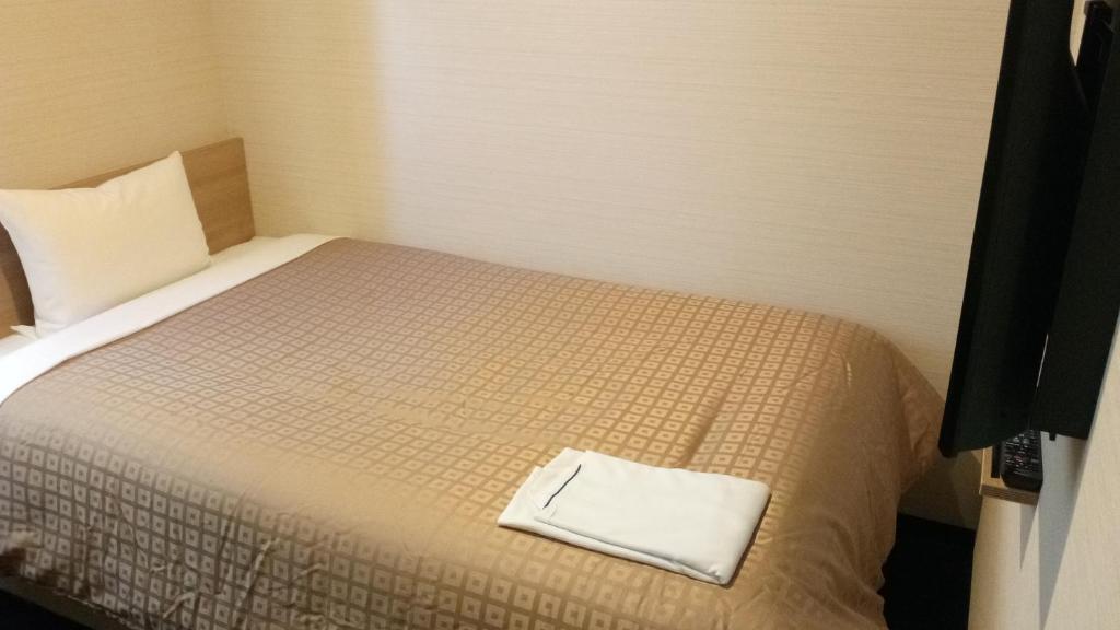 Postel nebo postele na pokoji v ubytování Meet Inn Narita