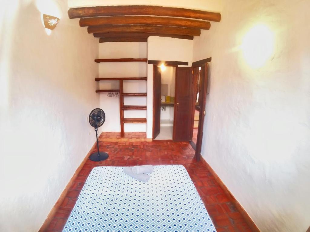 Postel nebo postele na pokoji v ubytování La Casa Del Toche Barichara