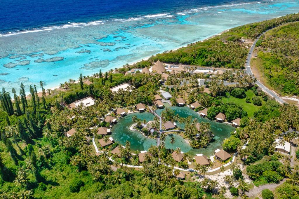 an aerial view of a resort next to the ocean at InterContinental Lifou Wadra Bay Resort in Akaouane