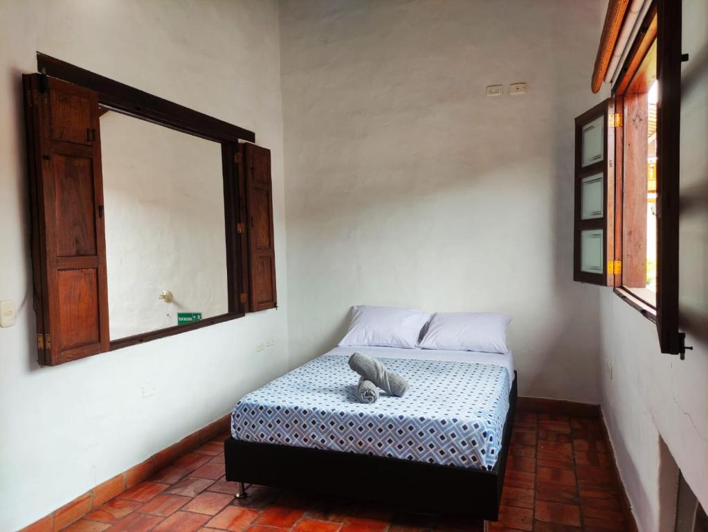 Postel nebo postele na pokoji v ubytování La Casa Del Toche Barichara