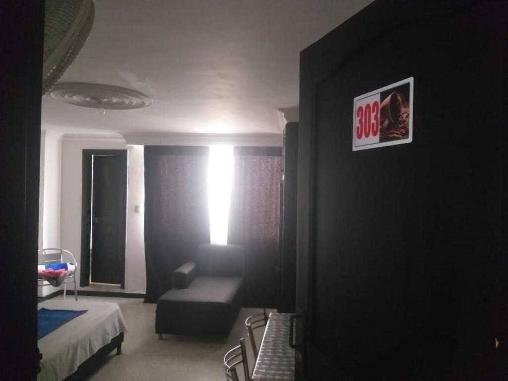 Postel nebo postele na pokoji v ubytování HOTEL EJE DEL CAFÉ