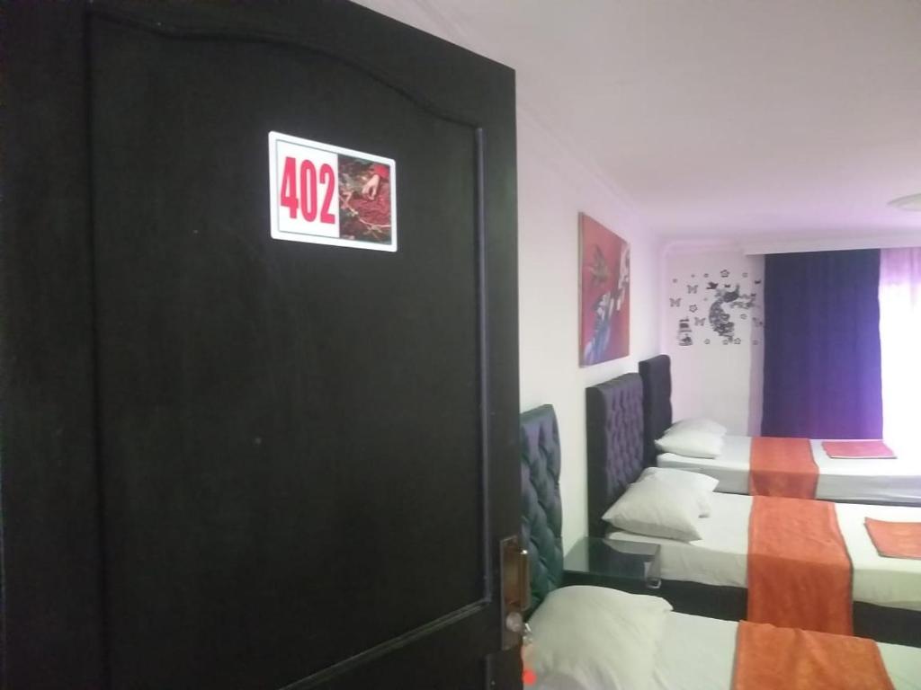 Postel nebo postele na pokoji v ubytování HOTEL EJE DEL CAFÉ