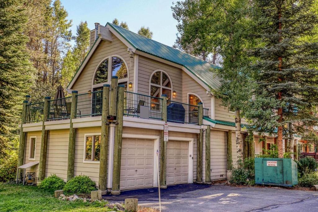 a house with a balcony and a garage at Donner Lake House in Truckee