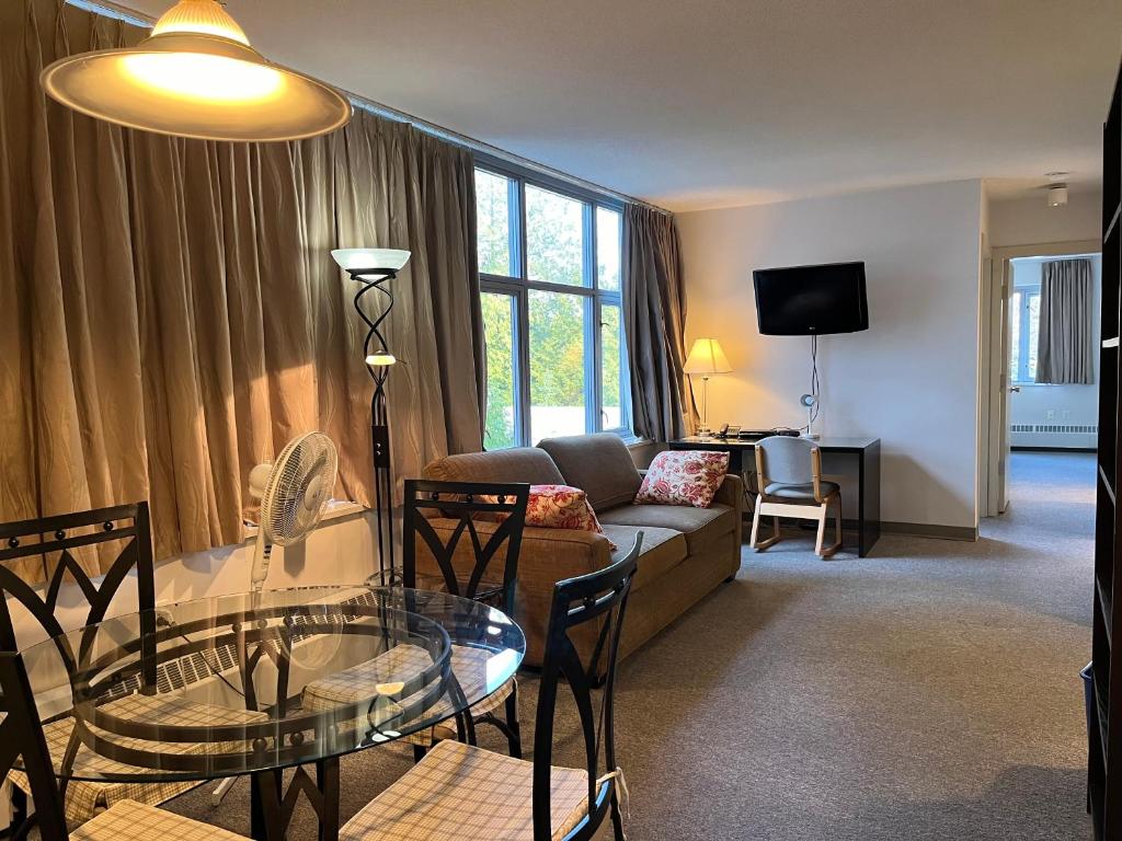 a living room with a couch and a table at Carey Centre on UBC campus in Vancouver
