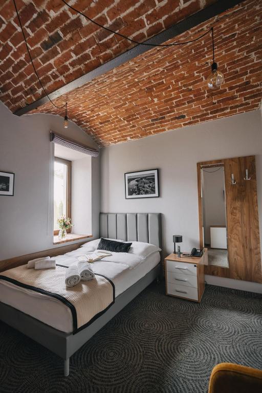 Postel nebo postele na pokoji v ubytování Dwór Kolesin