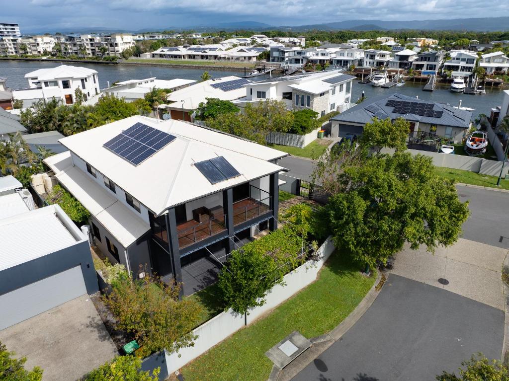 an aerial view of a house with solar panels on the roof at Hope Island Haven Retreat in Gold Coast