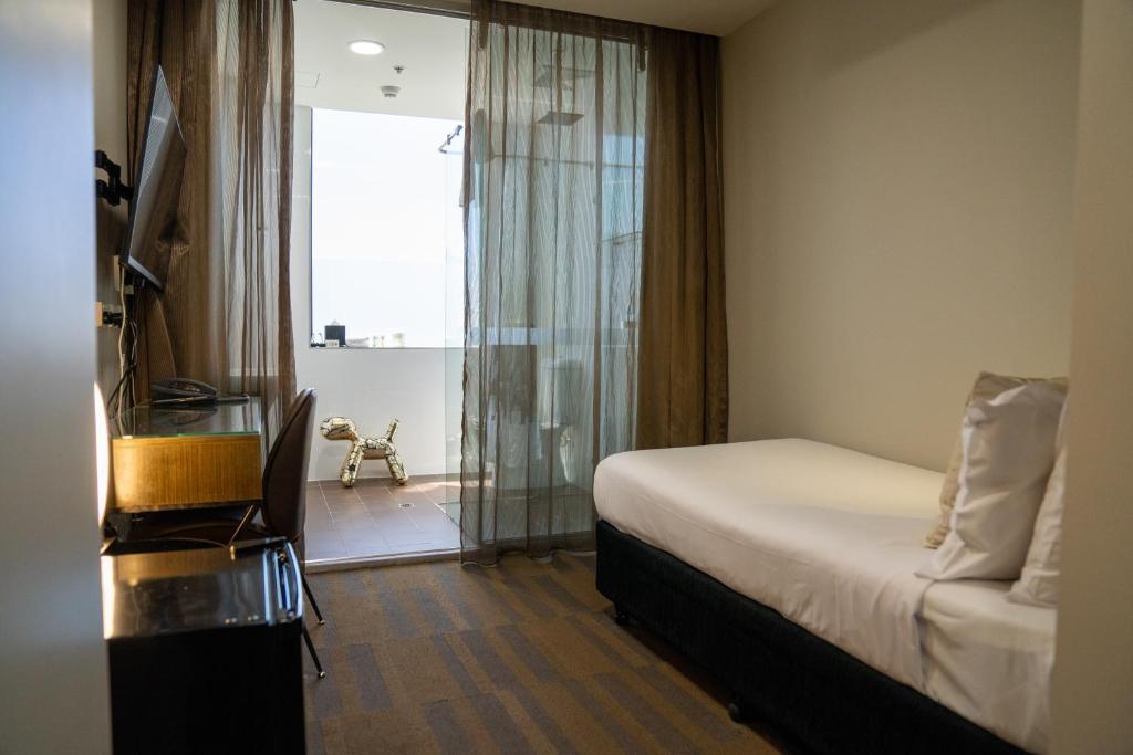 Postel nebo postele na pokoji v ubytování 57Hotel