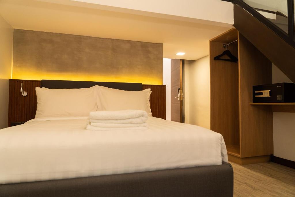 Postel nebo postele na pokoji v ubytování Altaroca Mountain Resort Antipolo