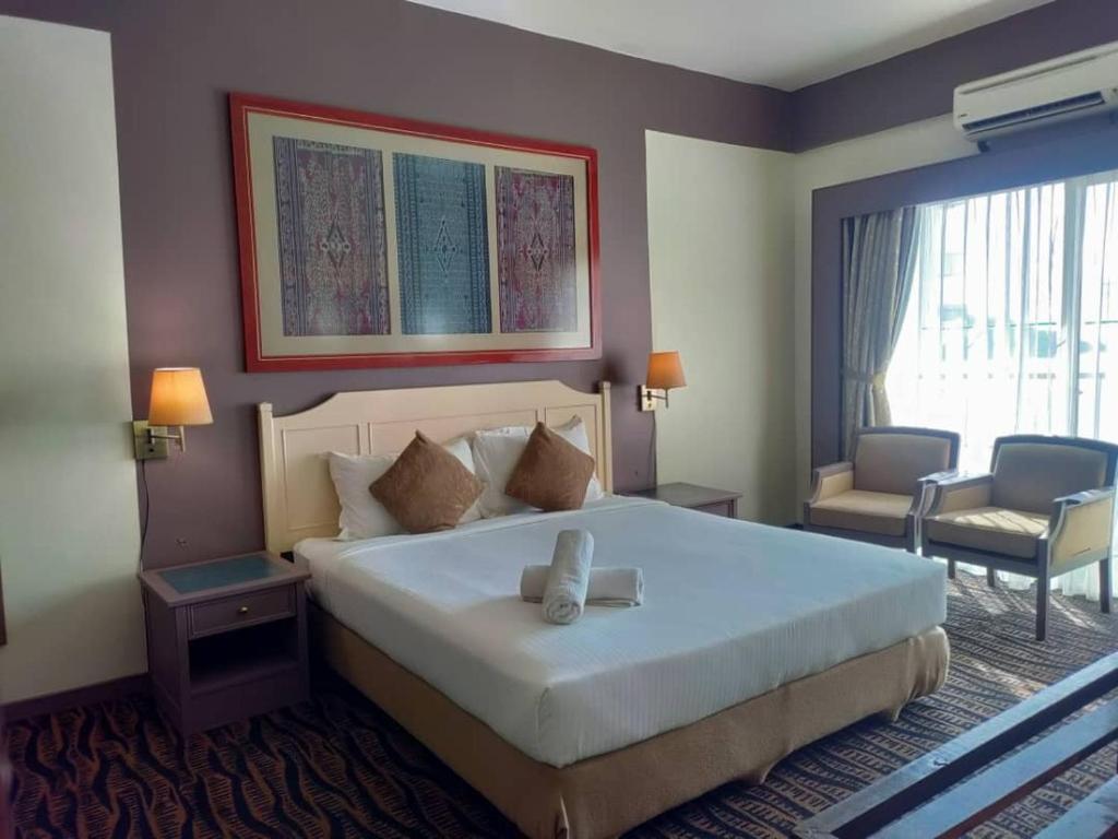 Llit o llits en una habitació de Rainbow Paradise BeachFront Penang