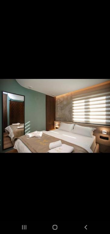 Postel nebo postele na pokoji v ubytování Hotel Flaer