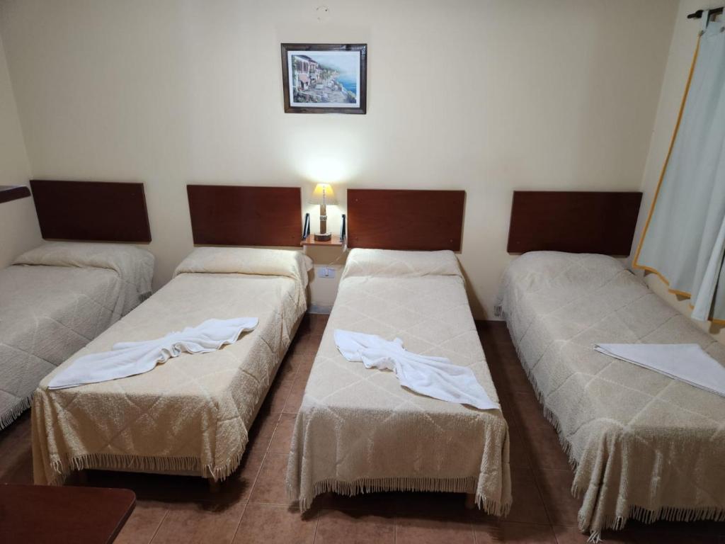Llit o llits en una habitació de Hotel LasNegritas