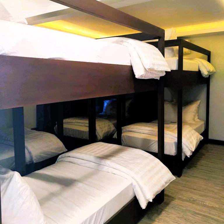Postel nebo postele na pokoji v ubytování Altaroca Mountain Resort Antipolo