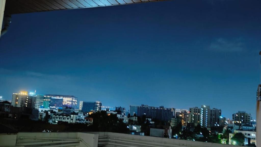 a view of a city skyline at night at The ten - one room in 3bhk in Pune