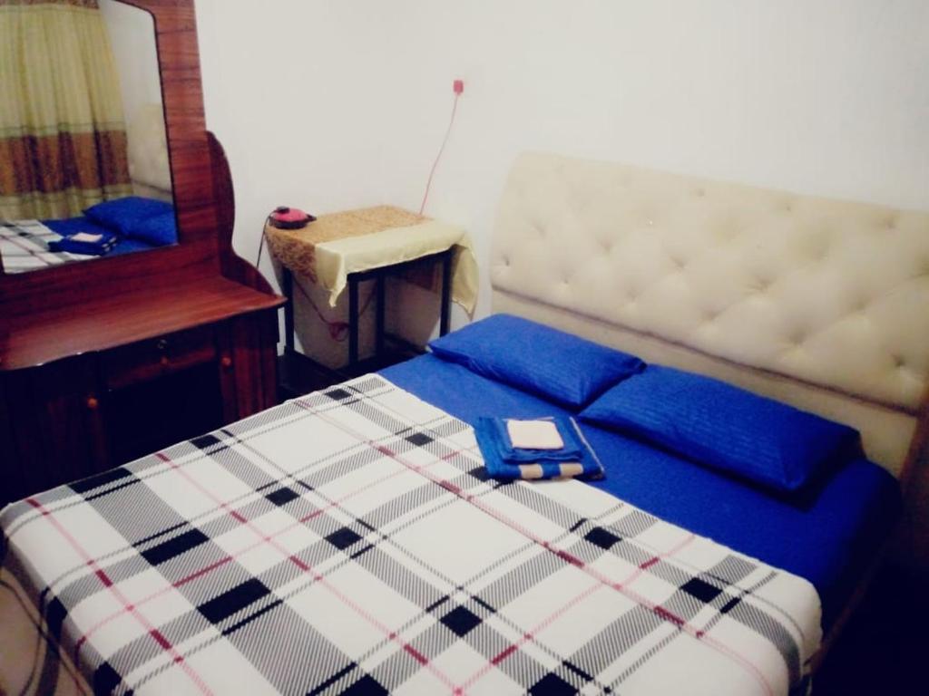 Postel nebo postele na pokoji v ubytování ASK Homestay