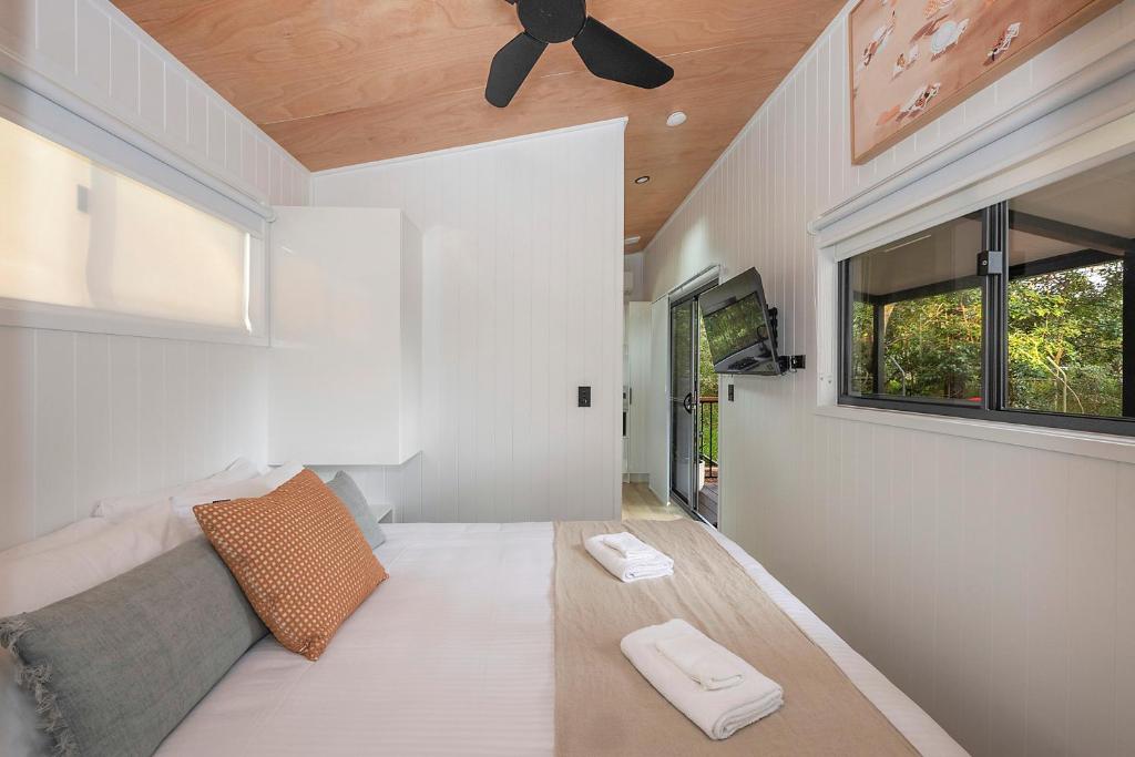 a living room with a couch and a ceiling fan at Reflections North Haven - Holiday Park in North Haven