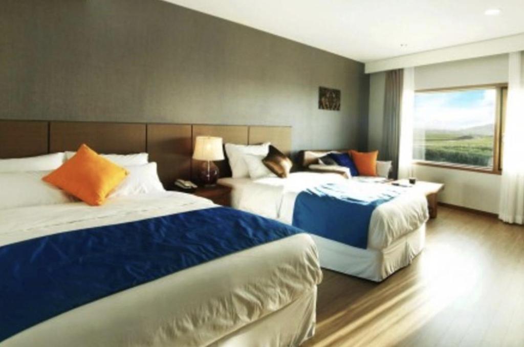 Postel nebo postele na pokoji v ubytování Login Hotel