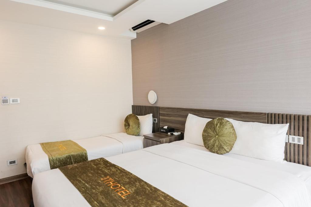 Postel nebo postele na pokoji v ubytování 3T Hotel Hanoi