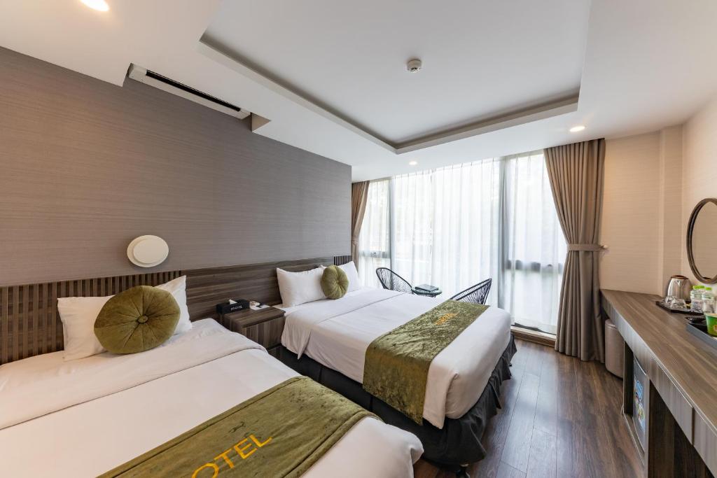 Postel nebo postele na pokoji v ubytování 3T Hotel Hanoi
