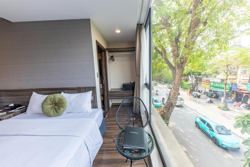 Postel nebo postele na pokoji v ubytování 3T Hotel Hanoi