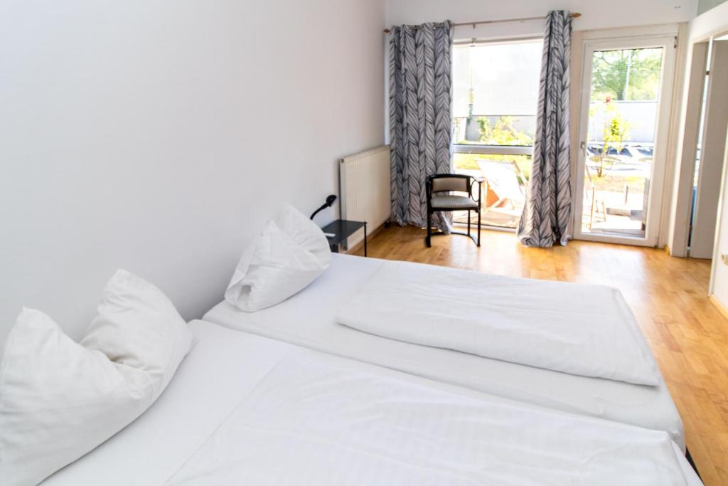 Postel nebo postele na pokoji v ubytování Hotel Restaurant Römerhof