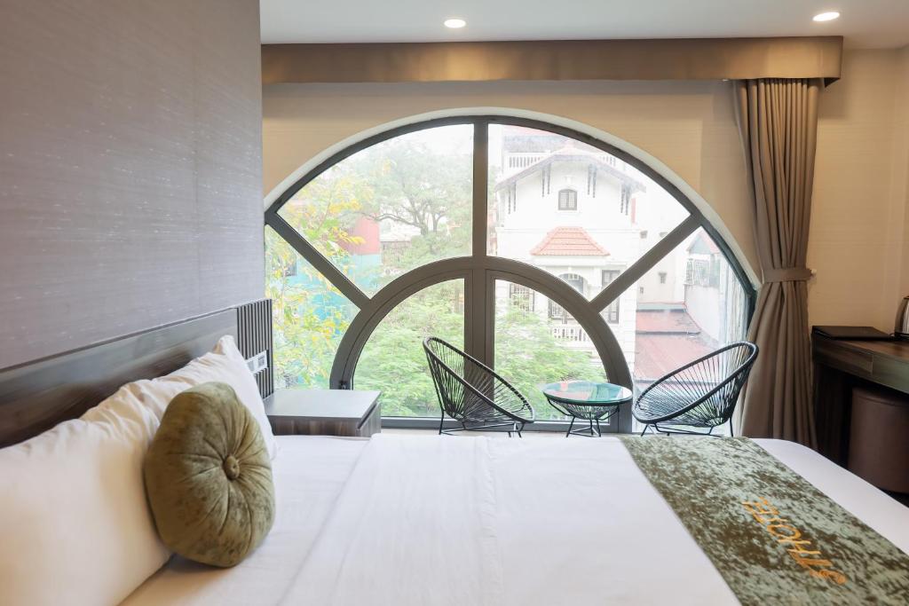 Postel nebo postele na pokoji v ubytování 3T Hotel Hanoi