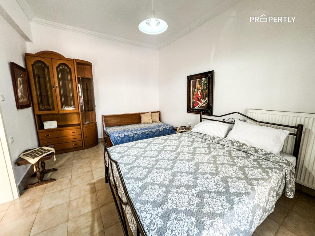 Ένα ή περισσότερα κρεβάτια σε δωμάτιο στο Areti's Family House