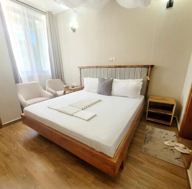 Кровать или кровати в номере Lavida Inn