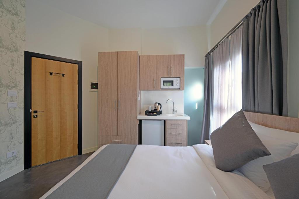 Postel nebo postele na pokoji v ubytování Comfy apart hotel