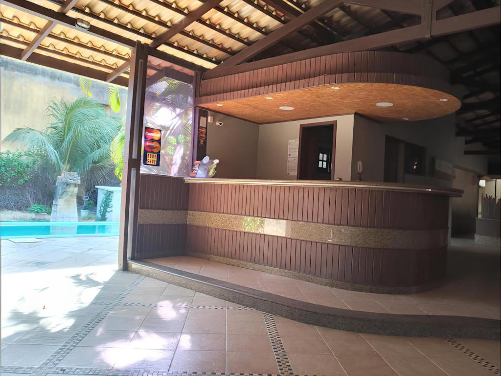 a lobby of a building with a bar in it at Hotel Navegantes Beach in Fortaleza